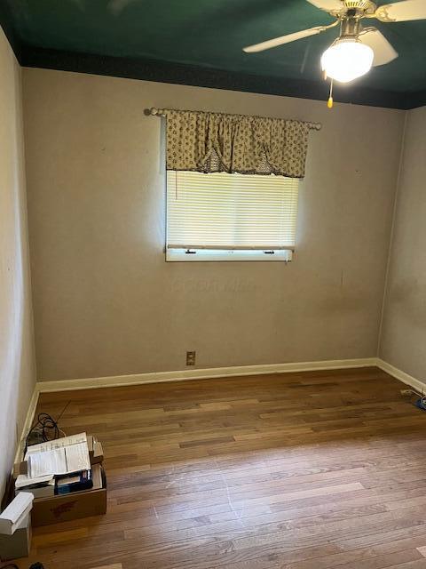 1886 Johnstown Utica Rd NE, Utica, OH 43080 - unfurnished room featuring hardwood / wood-style floors, ceiling fan, and baseboards