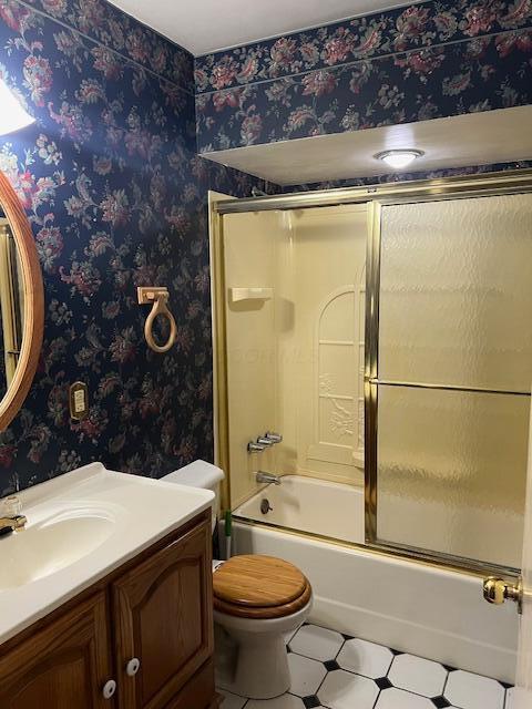 1886 Johnstown Utica Rd NE, Utica, OH 43080 - full bath featuring wallpapered walls, vanity, toilet, and shower / bath combination with glass door