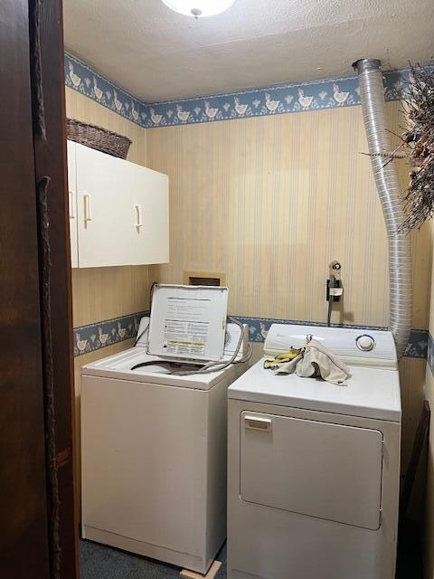 1886 Johnstown Utica Rd NE, Utica, OH 43080 - washroom featuring washing machine and clothes dryer, wallpapered walls, and cabinet space