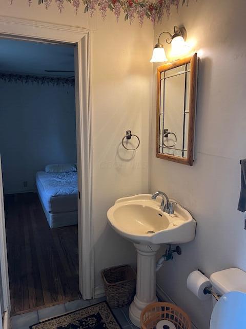 1886 Johnstown Utica Rd NE, Utica, OH 43080 - bathroom with toilet, wood finished floors, and a sink