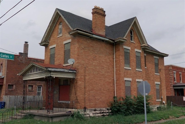 1284 Parsons Ave, Columbus, OH 43206 - view of property exterior with brick siding, fence, and a chimney