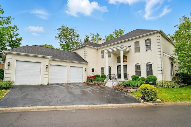 1940 Scioto Pointe Dr, Columbus, OH 43221 - greek revival inspired property featuring driveway, stucco siding, and a garage