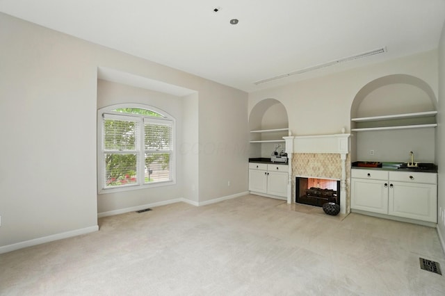 1940 Scioto Pointe Dr, Columbus, OH 43221 - unfurnished living room with light carpet, baseboards, and a multi sided fireplace