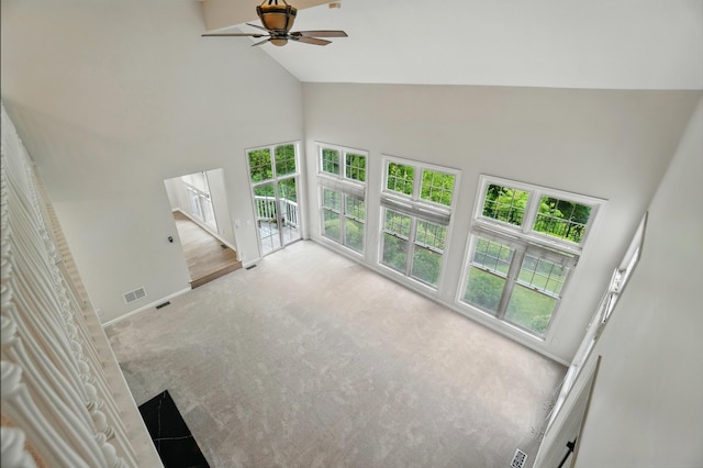 1940 Scioto Pointe Dr, Columbus, OH 43221 - unfurnished living room with high vaulted ceiling, a ceiling fan, carpet flooring, healthy amount of natural light, and baseboards