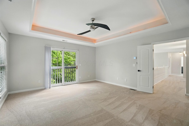 1940 Scioto Pointe Dr, Columbus, OH 43221 - empty room featuring a raised ceiling, carpet flooring, ceiling fan, and baseboards