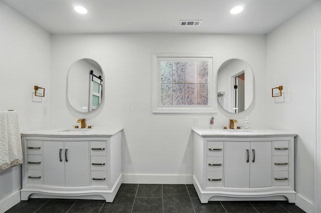 1940 Scioto Pointe Dr, Columbus, OH 43221 - full bathroom with two vanities, baseboards, and recessed lighting