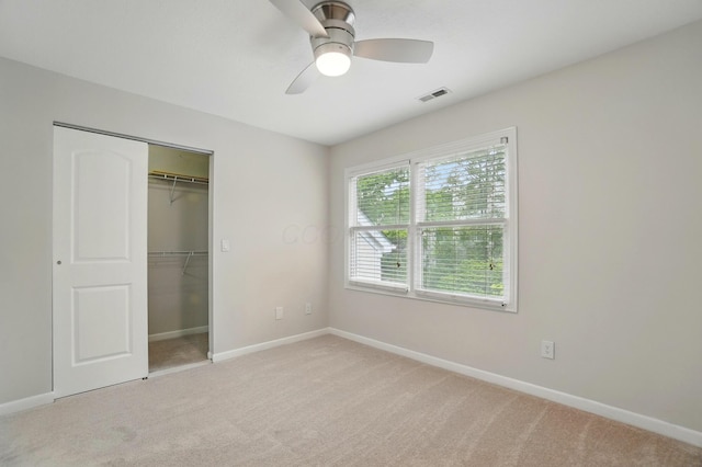 1940 Scioto Pointe Dr, Columbus, OH 43221 - unfurnished bedroom featuring light carpet, baseboards, a closet, and ceiling fan