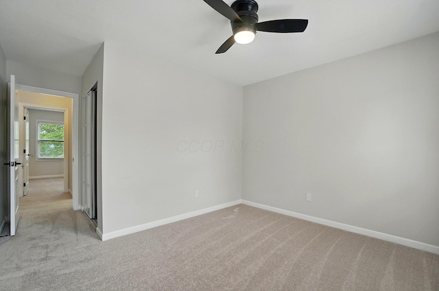 1940 Scioto Pointe Dr, Columbus, OH 43221 - unfurnished room featuring light colored carpet, baseboards, and a ceiling fan