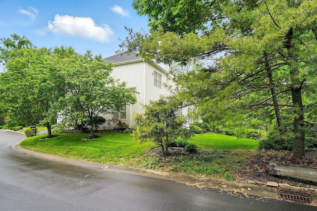 1940 Scioto Pointe Dr, Columbus, OH 43221 - view of property exterior with stucco siding and a lawn