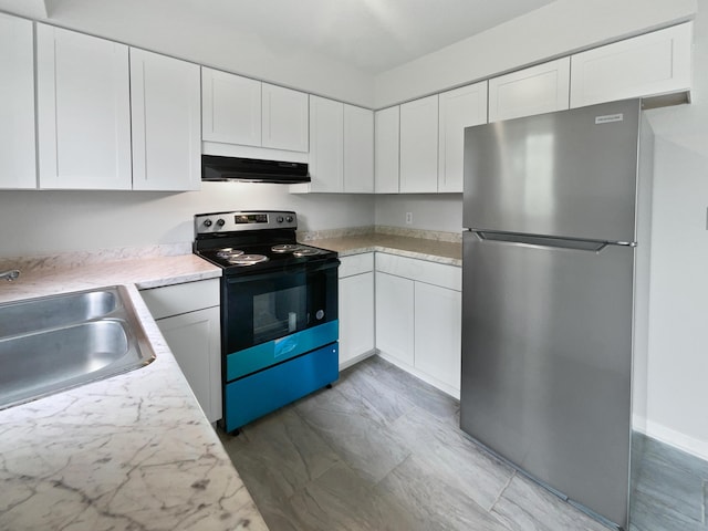 kitchen with black range with electric cooktop, freestanding refrigerator, a sink, under cabinet range hood, and light countertops