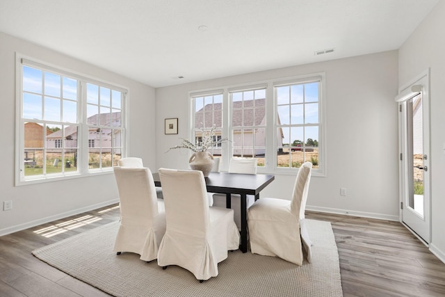 6039 Peck Ln, New Albany, OH 43054 - dining space featuring healthy amount of natural light and wood finished floors