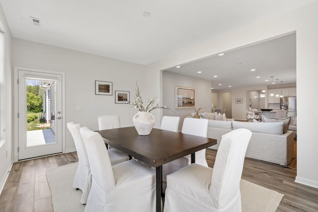 6039 Peck Ln, New Albany, OH 43054 - dining area with light wood-style floors, recessed lighting, and baseboards
