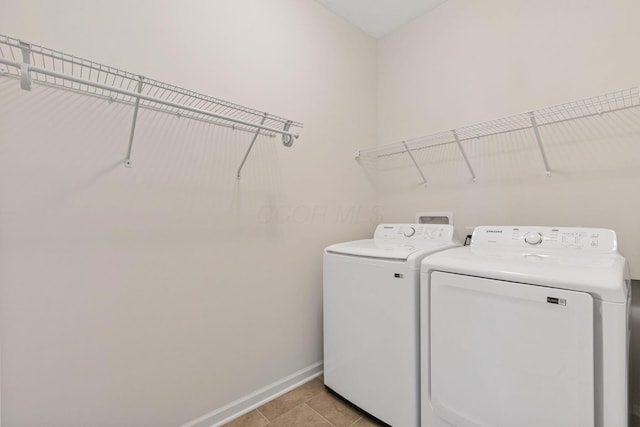 6039 Peck Ln, New Albany, OH 43054 - washroom with baseboards, washing machine and dryer, and light tile patterned floors