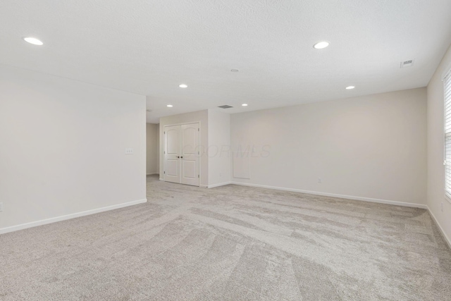 6039 Peck Ln, New Albany, OH 43054 - spare room featuring light carpet, recessed lighting, and baseboards