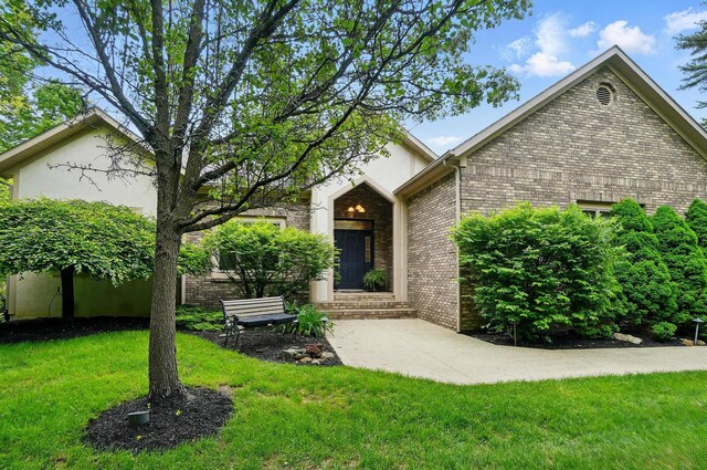 1092 George Allen Dr, South Vienna, OH 45369 - ranch-style home with a front yard and brick siding