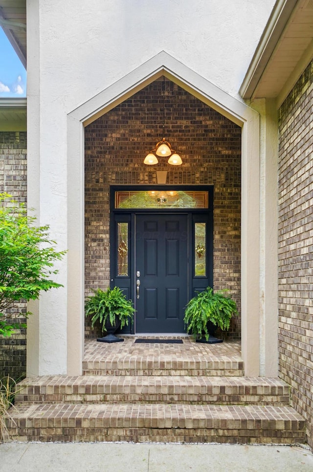 1092 George Allen Dr, South Vienna, OH 45369 - property entrance featuring stucco siding and brick siding