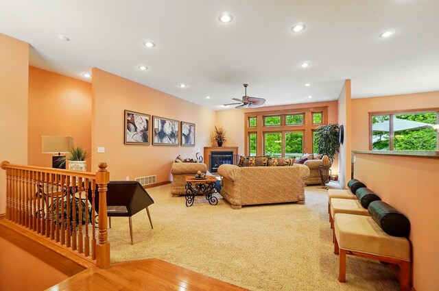 1092 George Allen Dr, South Vienna, OH 45369 - living area featuring ceiling fan, recessed lighting, carpet floors, a glass covered fireplace, and baseboards