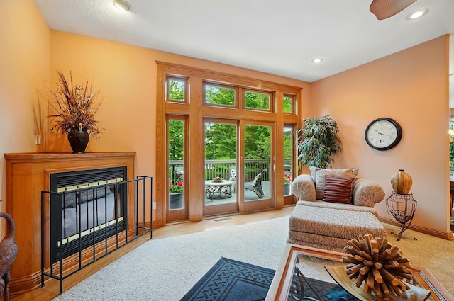 1092 George Allen Dr, South Vienna, OH 45369 - sitting room featuring carpet floors, a glass covered fireplace, recessed lighting, and baseboards