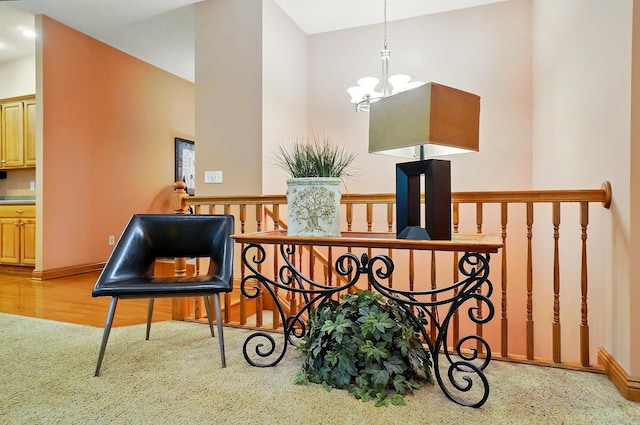 1092 George Allen Dr, South Vienna, OH 45369 - living area featuring a chandelier, an upstairs landing, baseboards, and carpet flooring