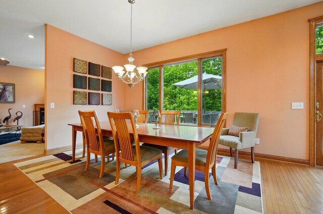 1092 George Allen Dr, South Vienna, OH 45369 - dining space featuring healthy amount of natural light, light wood-type flooring, recessed lighting, baseboards, and a chandelier
