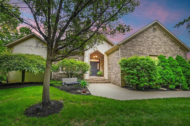 1092 George Allen Dr, South Vienna, OH 45369 - view of front of house featuring a yard and brick siding