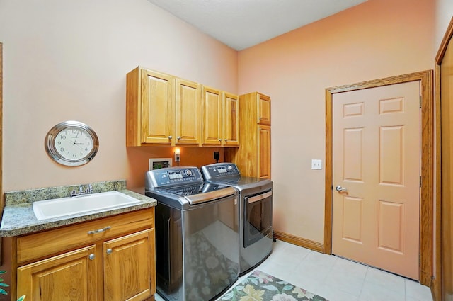 1092 George Allen Dr, South Vienna, OH 45369 - laundry area with washer and dryer, cabinet space, and light tile patterned floors