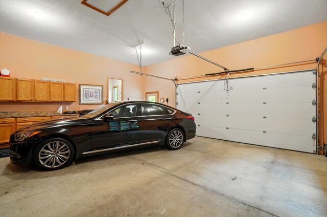 1092 George Allen Dr, South Vienna, OH 45369 - garage featuring a garage door opener