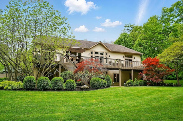1092 George Allen Dr, South Vienna, OH 45369 - back of house featuring stucco siding, a lawn, and a wooden deck