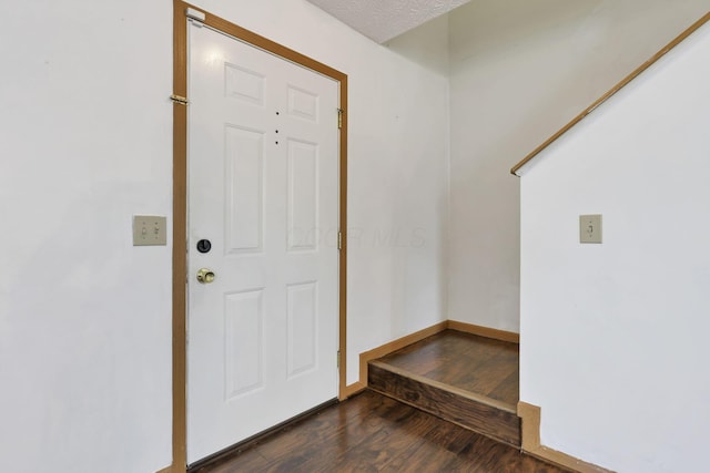 5504 Rothermund Dr, Canal Winchester, OH 43110 - entryway with dark wood-type flooring and baseboards