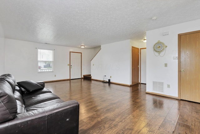 5504 Rothermund Dr, Canal Winchester, OH 43110 - living area featuring wood finished floors, a textured ceiling, and baseboards