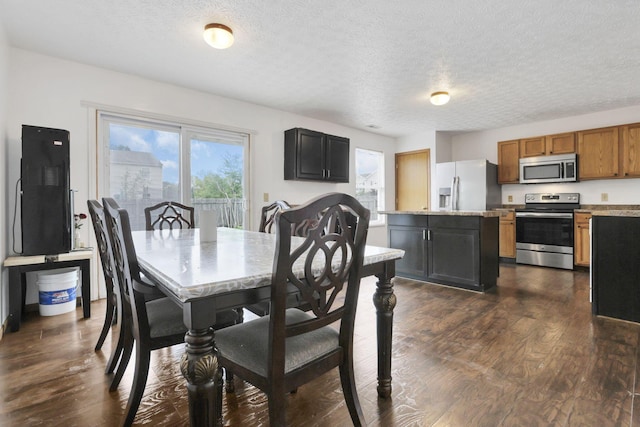 5504 Rothermund Dr, Canal Winchester, OH 43110 - dining space featuring a textured ceiling and dark wood finished floors