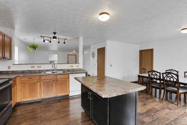 5504 Rothermund Dr, Canal Winchester, OH 43110 - kitchen featuring dishwasher, a sink, electric range, dark wood-style flooring, and a textured ceiling