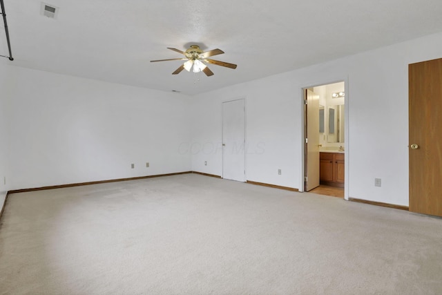 5504 Rothermund Dr, Canal Winchester, OH 43110 - unfurnished bedroom featuring light colored carpet, baseboards, connected bathroom, and ceiling fan