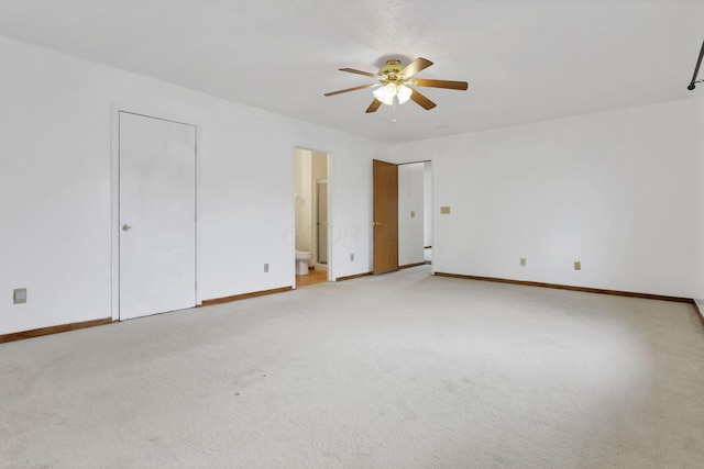 5504 Rothermund Dr, Canal Winchester, OH 43110 - unfurnished bedroom featuring light colored carpet, baseboards, connected bathroom, and a ceiling fan