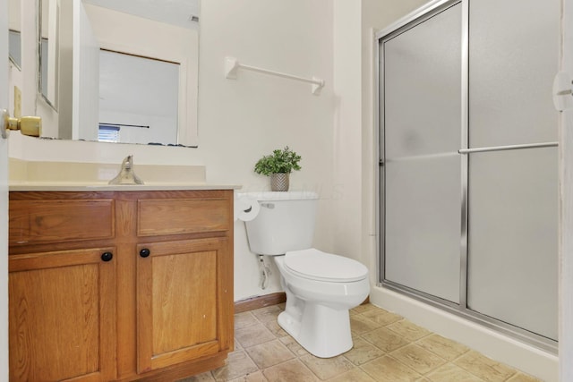 5504 Rothermund Dr, Canal Winchester, OH 43110 - full bathroom featuring a shower stall, toilet, vanity, and baseboards