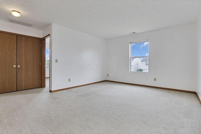 5504 Rothermund Dr, Canal Winchester, OH 43110 - unfurnished bedroom with baseboards, a textured ceiling, and light colored carpet