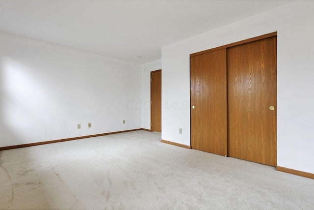 5504 Rothermund Dr, Canal Winchester, OH 43110 - unfurnished bedroom with carpet flooring, baseboards, and a closet