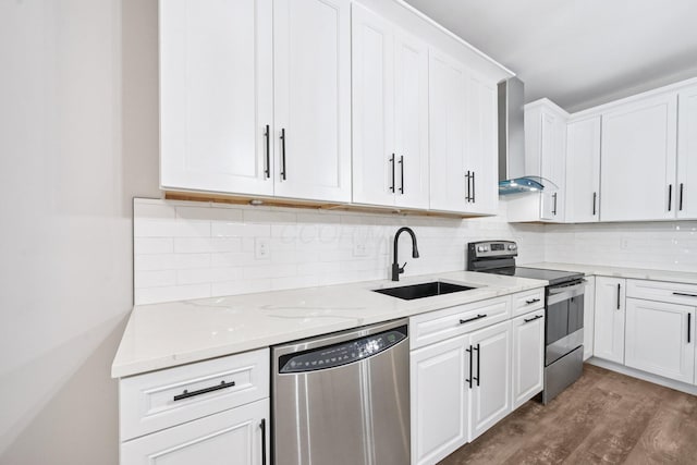 434 S Champion Ave, Columbus, OH 43205 - kitchen with appliances with stainless steel finishes, wall chimney range hood, white cabinets, and light stone countertops