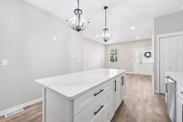 434 S Champion Ave, Columbus, OH 43205 - kitchen featuring a chandelier, stainless steel dishwasher, light wood finished floors, hanging light fixtures, and a kitchen island