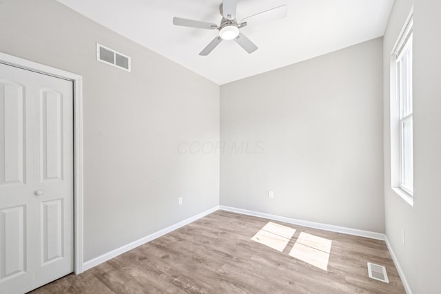434 S Champion Ave, Columbus, OH 43205 - unfurnished bedroom with wood finished floors, lofted ceiling, and a ceiling fan