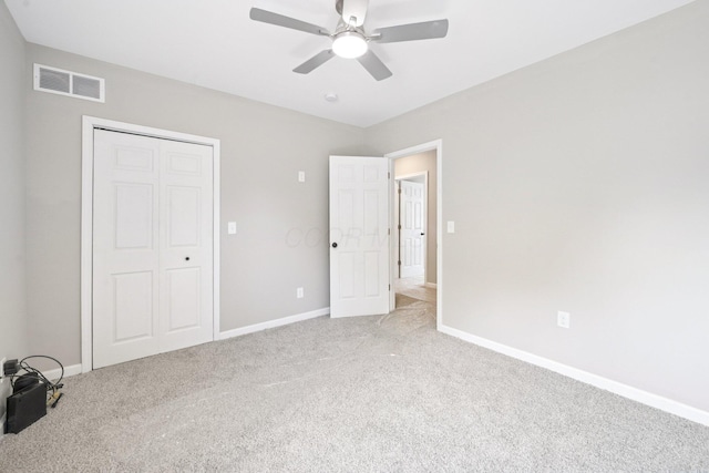 434 S Champion Ave, Columbus, OH 43205 - unfurnished bedroom with light colored carpet, a closet, and a ceiling fan