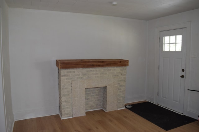 300 Wrexham Ave, Columbus, OH 43223 - foyer entrance featuring wood finished floors and a brick fireplace