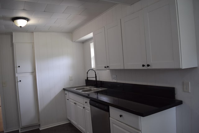 300 Wrexham Ave, Columbus, OH 43223 - kitchen with stainless steel dishwasher, dark countertops, and white cabinets