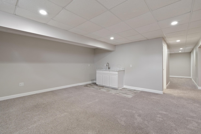4526 Hoffman Farms Dr, Hilliard, OH 43026 - finished below grade area featuring light colored carpet, baseboards, wet bar, recessed lighting, and a paneled ceiling