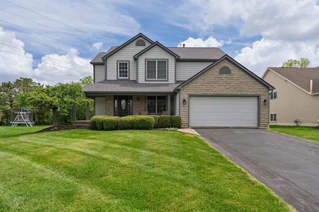 4526 Hoffman Farms Dr, Hilliard, OH 43026 - traditional-style house featuring driveway, a garage, stone siding, a front yard, and roof with shingles