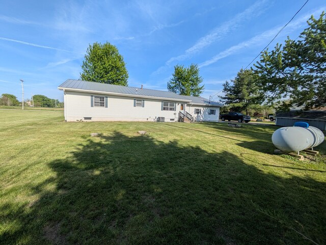 4280 Township Road 230, Cardington, OH 43315 - back of property with a lawn and metal roof
