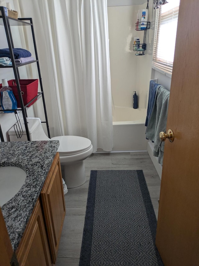 4280 Township Road 230, Cardington, OH 43315 - bathroom with toilet, vanity, shower / bath combo, and wood finished floors