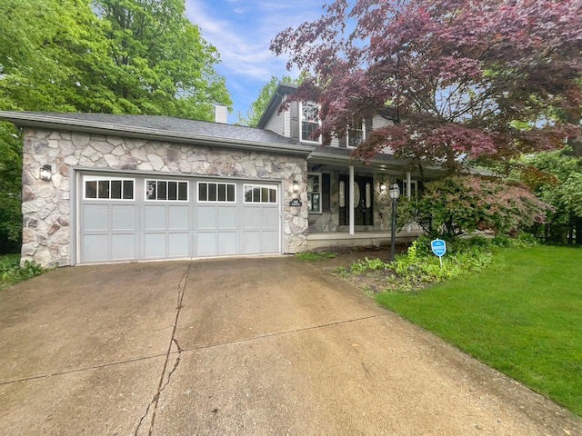 642 Ridenour Rd, Columbus, OH 43230 - view of front of house with stone siding, a chimney, a porch, a front lawn, and a garage