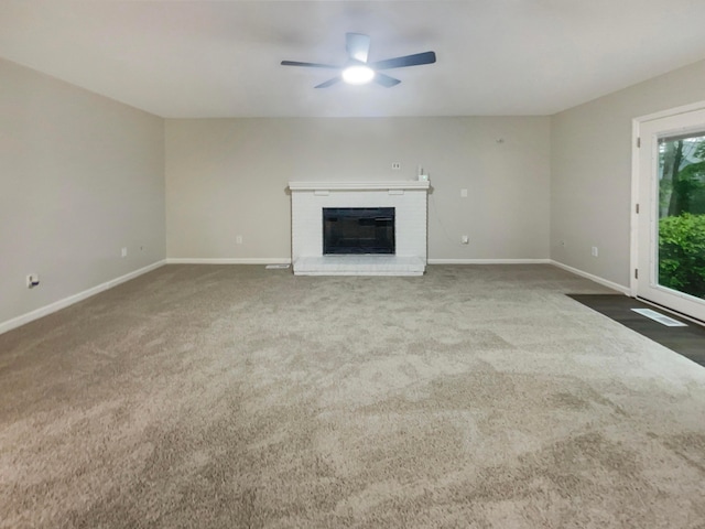 642 Ridenour Rd, Columbus, OH 43230 - unfurnished living room with ceiling fan, baseboards, a fireplace, and carpet floors