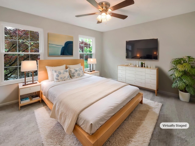 642 Ridenour Rd, Columbus, OH 43230 - carpeted bedroom with baseboards and a ceiling fan